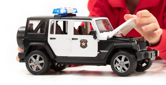 Bruder 02526 Jeep Rubicon Police Car + Light Skin Policeman